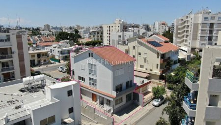 Three storey semi detached mixed use building with shop and attic in Strovolos Nicosia