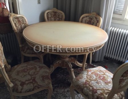 Round table with chairs for sale.